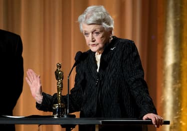 (FILES) In this file photo taken on November 16, 2013 Honoree Angela Lansbury accept her award on stage during the 2013 Governors Awards, presented by the American Academy of Motion Picture Arts and Sciences (AMPAS), at the Grand Ballroom of the Hollywood and Highland Center in Hollywood, California. - Actress Angela Lansbury, who became a household name through her role as a writer-detective in "Murder, She Wrote," has died, her family said October 11, 2022. She was 96. (Photo by Robyn BECK / AFP)