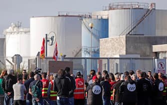 epa10235615 Workers from TotalEnergies and Esso ExxonMobil attend a protest called by CGT union outside Esso refinery in Fos-Sur-Mer, France, 11 October 2022. The two weeks strike at refineries affected the country's domestic fuel output and caused shortage at French gas stations.  EPA/GUILLAUME HORCAJUELO