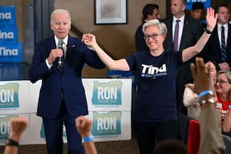 US President Joe Biden introduces Tina Kotek (R), the Democratic nominee for governor of Oregon, during an Oregon Democrats grassroots phone banking event at SEIU Local 49 in Portland, Oregon, October 14, 2022. (Photo by SAUL LOEB / AFP) (Photo by SAUL LOEB/AFP via Getty Images)