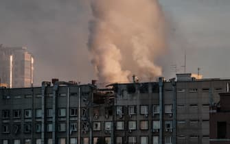 TOPSHOT - Smoke rises from a partially destroyed building in Kyiv on October 17, 2022, amid the Russian invasion of Ukraine. (Photo by Yasuyoshi CHIBA / AFP) (Photo by YASUYOSHI CHIBA/AFP via Getty Images)
