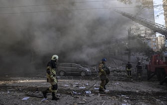 KYIV, UKRAINE - OCTOBER 17: Firefighters conduct work in a destroyed building after the Russian drone attacks in Kyiv, Ukraine on October 17, 2022. At least 4 separate explosions were heard in Kyiv, while authorities reported that the attacks were carried out with kamikaze drones.  (Photo by Metin Aktas / Anadolu Agency via Getty Images)