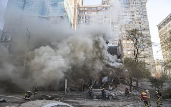KYIV, UKRAINE - OCTOBER 17: Firefighters conduct work in a destroyed building after Russian attacks in Kyiv, Ukraine on October 17, 2022. It was reported that two separate explosions occurred in Kyiv due to the attacks carried out by the Russian forces in the early hours of the morning.  (Photo by Metin Aktas / Anadolu Agency via Getty Images)