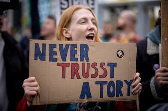 epa10219919 People protest outside Conservative Party Conference in Birmingham, Britain, 02 October 2022.  Prime Minister Liz Truss admitted they were flaws with the announcement of her 'mini-budget' which led to market turmoils and British pound going historic low against the US dollar.  EPA/TOLGA AKMEN