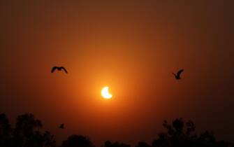 A view of a partial solar eclipse is seen in New Delhi, India on October 25, 2022. (Photo by Arrush Chopra / NurPhoto via Getty Images)