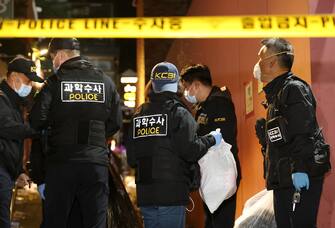 epa10274545 Police investigators work in an alley of the Itaewon district after a stampede during Halloween celebrations, in Seoul, South Korea, 30 October 2022. According to the National Fire Agency, 151 people were killed and 82 were injured in the stampede on 29 October as a large crowd came to celebrate Halloween.  EPA/YONHAP SOUTH KOREA OUT