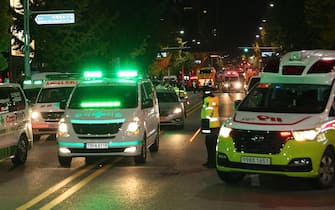 epa10274548 Emergency vehicles fill a street after a stampede during Halloween celebrations in the Itaewon district, in Seoul, South Korea, 30 October 2022. According to the National Fire Agency, 151 people were killed and 82 were injured in the stampede on 29 October as a large crowd came to celebrate Halloween.  EPA/YONHAP SOUTH KOREA OUT