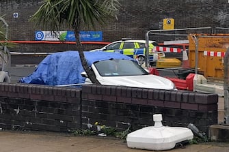 epa10275012 A car beleived to be belonging to a suspect following an attack on a migrant processing center in Dover, Britain, 30 October 2022. The suspected attacker was believed to have thrown petrol bombs at the migrant center before taking his own life, according to witnesses .  EPA / STUART BROCK