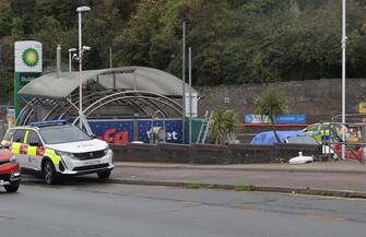 epa10275013 A car (R) beleived to be belonging to a suspect following an attack on a migrant processing centre in Dover, Britain, 30 October 2022. The suspected attacker was believed to have thrown petrol bombs at the migrant centre before taking his own life, according to witnesses.  EPA/STUART BROCK