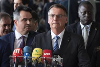 epa10279802 Out-going Brasilian president Jair Bolsonaro, speaks to the media about the results of the Presidential elections, Brasilia, Brazil, 01 November 2022. Bolsonaro, assured that he  will continue to be faithful to the constitution .  EPA/Joedson Alves