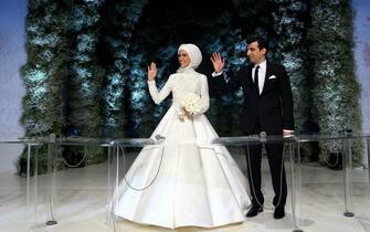 epa05306090 A handout picture provided by the Turkish President's Press office on 14 May 2016 shows President Recep Tayyip Erdogan's daughter Sumeyye Erdogan (L) and her husband Selcuk Bayraktar (R) posing after their wedding ceremony at the Yahya Kemal Beyatli Arena, in Istanbul, Turkey, 14 May 2016. Erdogan' younger daughter Sumeyye married the defense industrialist Selcuk Bayraktar, in a high security ceremony in Istanbul.  EPA/TURKISH PRESIDENT PRESS OFFICE/HANDOUT  HANDOUT EDITORIAL USE ONLY/NO SALES