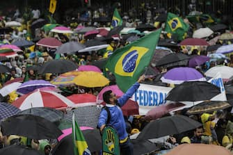 epa10281753 Supporters of Brazil's outgoing President Jair Bolsonaro protest against the election results, outside the Eastern Military Command in Rio de Janeiro, Brazil, 02 November 2022. Thousands of people have gathered in front of the gates of barracks in Sao Paulo, Brasilia and Rio de Janeiro to demand a 'military intervention' against the electoral victory of progressive leader Luiz Inacio Lula da Silva. The rallies were organized through social networks by far-right groups that support Bolsonaro and do not recognize Lula's democratic election.  EPA/ANTONIO LACERDA