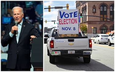 Il presidente Usa Biden e un cartello che invita al voto 