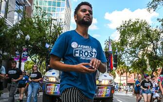 Maxwell Frost, a Democratic candidate for Florida's 10th Congressional district, participates in the Pride Parade in Orlando, Florida, on October 15, 2022. - Running in a Florida district generally won by his party, his path to the House of Representatives seems all mapped out during the mid-term elections in November. He would become the first member of "Generation Z"  today's teens and young adults  to serve in Congress. The young African-American, raised by an adoptive mother of Cuban origin, would stand out among the white faces and gray hair that populate the US Congress - in the lower house, the average age is 58 years. (Photo by Giorgio VIERA / AFP) (Photo by GIORGIO VIERA/AFP via Getty Images)