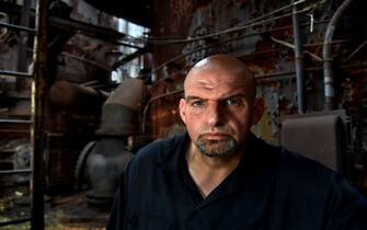 BRADDOCK, PA-JUN 10: - Braddock, Pennsylvania mayor John Fetterman at the Carrie Furnaces, a former steel mill near Braddock that's now open for tours. Marketing the  history of the steel culture to outsiders has been part of the plan to revive the area. Many young people are involved in a burgeoning art scene in Braddock with the rustic backdrop of the faded steel industry as a lure. --Photos to accompany a profile of Braddock Mayor John Fetterman who is currently running for Lt. Governor of Pennsylvania. He has made great strides in bringing the depressed town back to life. He hopes to spread some of his ideas and initiatives to other areas as he seeks statewide office. (Photo by Michael S. Williamson/The Washington Post via Getty Images)