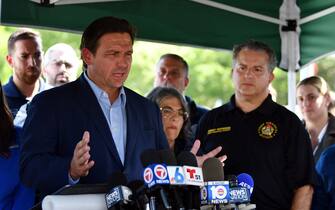 Jun 27, 2021; Surfside, Florida, USA; Florida governor Ron DeSantis addresses the media near the partially collapsed Champlain Towers South condo located in Surfside, FL.  Currently, 9 people have been confirmed dead and more than 150 people are still unaccounted for as rescue teams from Miami-Dade and Broward County assist in the rescue efforts. Mandatory Credit: Jim Rassol-USA TODAY NETWORK/Sipa USA
