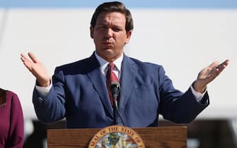 MIAMI GARDENS, FLORIDA - JANUARY 06: Florida Governor Ron DeSantis speaks during a press conference about the opening of a COVID-19 vaccination site at the Hard Rock Stadium on January 06, 2021 in Miami Gardens, Florida. The governor announced that the stadium's parking lot which offers COVID-19 tests will begin to offer COVID-19 vaccinations for residents 65 and older to drive up and get vaccinated. The vaccination site opened today for a trial run but it was not known when it will be open to the general public. (Photo by Joe Raedle/Getty Images)