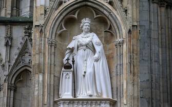 A statue of the late Queen Elizabeth II, unveiled by Britain's King Charles III as part of his two-day tour of Yorkshire, is pictured at York Minster, in York, northern England on November 9, 2022. - The statue of Queen Elizabeth II is one of a number of projects emerging from the York Minster Neighbourhood Plan and funded by the York Minster Fund (YMF), and was designed and carved by York Minster stonemason Richard Bossons. (Photo by Lindsey Parnaby / AFP) (Photo by LINDSEY PARNABY/AFP via Getty Images)