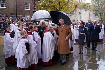 Britain's King Charles III, accompanied by Britain's Camilla, Queen Consort, looks up toward a statue of his late mother, Queen Elizabeth II, after he unveiled it during a visit to York Minster in York, northern England on November 9, 2022 as part of his two-day tour of Yorkshire. - The statue of Queen Elizabeth II is one of a number of projects emerging from the York Minster Neighbourhood Plan and funded by the York Minster Fund (YMF), and was designed and carved by York Minster stonemason Richard Bossons. (Photo by Danny Lawson / POOL / AFP) (Photo by DANNY LAWSON/POOL/AFP via Getty Images)