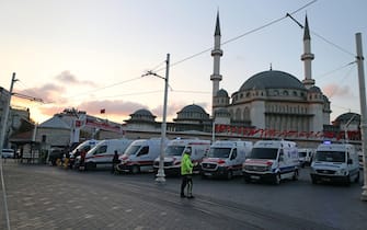 epa10303637 Ambulances are waiting at the Taksim Square as Turkish policemen try to secure the area after an explosion at Istiklal Street, in Istanbul, Turkey 13 November 2022. According to governor Ali Yerlikaya, an explosion that occurred at roughly 4.20 p.m. local time has resulted in losses and injuries. Emergency personnel were dispatched to the incident.  EPA/ERDEM SAHIN