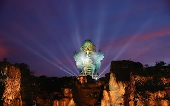 epa10306761 The Garuda Wisnu Kencana statue is lit up ahead of a Welcoming Dinner of the G20 Leaders' Summit at the Garuda Wisnu Kencana Cultural Park in Bali, Indonesia, 15 November 2022. The 17th Group of Twenty (G20) Heads of State and Government Summit runs from 15 to 16 November 2022.  EPA/WILLY KURNIAWAN / POOL