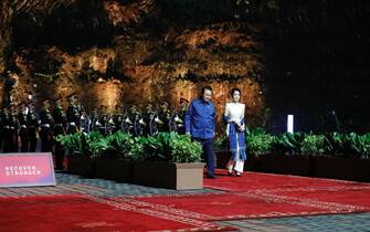 epa10307009 South Korea's President Yoon Suk-yeol (C) and his wife Kim Keon-hee arrive to attend a Welcoming Dinner of the G20 Leaders' Summit at the Garuda Wisnu Kencana Cultural Park in Bali, Indonesia, 15 November 2022. The 17th Group of Twenty (G20) Heads of State and Government Summit runs from 15 to 16 November 2022.  EPA/WILLY KURNIAWAN / POOL