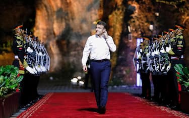 epa10306833 French President Emmanuel Macron arrives to attend a Welcoming Dinner of the G20 Leaders' Summit at the Garuda Wisnu Kencana Cultural Park in Bali, Indonesia, 15 November 2022. The 17th Group of Twenty (G20) Heads of State and Government Summit runs from 15 to 16 November 2022.  EPA/WILLY KURNIAWAN / POOL