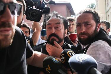 epa06880266 Televangelist Adnan Oktar (C) escorted by Turkish Combating Financial Crimes department after operation for his criminal organization in Istanbul, Turkey, 11 July 2018. Oktar hosts talk show programmes on his television channel, A9, on which he has discussed Islamic values and sometimes danced with young women he calls 'kittens' and sang with young men, his 'lions'.  EPA/ARIF HUDAVERDI YAMAN TURKEY OUT, USA OUT, UK OUT, CANADA OUT, FRANCE OUT, SWEDEN OUT, IRAQ OUT, JORDAN OUT, KUWAIT OUT, LEBANON OUT, OMAN OUT, QATAR OUT, SAUDI ARABIA OUT, SYRIA OUT, UAE OUT, YEMEN OUT, BAHRAIN OUT, EGYPT OUT, LIBYA OUT, ALGERIA OUT, MOROCCO OUT, TUNISIA OUT,