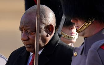 South Africa's President Cyril Ramaphosa (L) inspects a Guard of Honour, formed by Number 7 Company Coldstream Guards, during a Ceremonial Welcome on Horse Guards Parade in London on November 22, 2022, at the start of the President's two-day state visit. - King Charles III is hosting his first state visit as monarch, welcoming South Africa's President to Buckingham Palace. (Photo by Kirsty Wigglesworth / POOL / AFP) (Photo by KIRSTY WIGGLESWORTH/POOL/AFP via Getty Images)