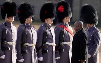 President of South Africa Cyril Ramaphosa walks through soldiers at a Ceremonial Welcome at Horse Guards Parade in London, Tuesday, Nov. 22, 2022. The President of South Africa is on a State Visit to the United Kingdom where the King and Queen Consort will host at Buckingham Palace. (AP Photo/Kirsty Wigglesworth, Pool)