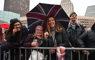 Royal watchers await the arrival of Britain's Prince William, Prince of Wales, and Catherine, Princess of Wales, for the Earthshot Prize ceremony, at City Hall Plaza in Boston, Massachusetts, on November 30, 2022. (Photo by ANGELA WEISS / AFP) (Photo by ANGELA WEISS/AFP via Getty Images)