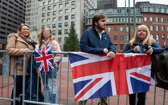 Royal watchers await the arrival of Britain's Prince William, Prince of Wales, and Catherine, Princess of Wales, for the Earthshot Prize ceremony, at City Hall Plaza in Boston, Massachusetts, on November 30, 2022. (Photo by Joseph Prezioso / AFP) (Photo by JOSEPH PREZIOSO/AFP via Getty Images)