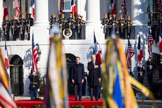 epa10341495 US President Joe Biden welcomes French President Emmanuel Macron to the White House for the first state visit of the Biden administration, on the South Lawn of the White House in Washington, DC, USA, 01 December 2022.  EPA/JIM LO SCALZO