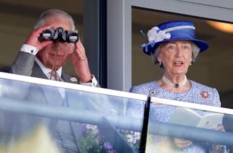 ASCOT, UNITED KINGDOM - JUNE 15: (EMBARGOED FOR PUBLICATION IN UK NEWSPAPERS UNTIL 24 HOURS AFTER CREATE DATE AND TIME) Prince Charles, Prince of Wales watches the racing through binoculars as he and Lady Susan Hussey (Lady-in-waiting to Queen Elizabeth II) attend day 2 of Royal Ascot at Ascot Racecourse on June 15, 2022 in Ascot, England. (Photo by Max Mumby/Indigo/Getty Images)