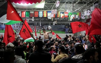 Palestinian supporters of Morocco watch the Qatar 2022 World Cup round 16 football match between Spain and Morocco, in Gaza City, on December 6, 2022. (Photo by Mohammed ABED / AFP) (Photo by MOHAMMED ABED/AFP via Getty Images)
