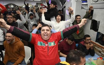 epa10352554 Fans of Morocco celebrate in El Ejido, Almeria, Spain, 06 December 2022, after the FIFA World Cup 2022 round of 16 soccer match between Morocco and Spain in Qatar. Morocco beat Spain on penalties and advanced to the quarter finals.  EPA/Carlos Barba