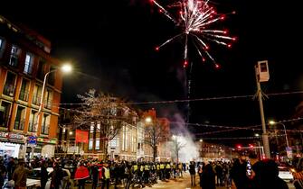 epa10352431 Fans of Morocco celebrate on the Vaillantlaan street in The Hague, Netherlands, 06 December 2022, after the FIFA World Cup 2022 round of 16 soccer match between Morocco and Spain in Doha, Qatar.  Morocco won 3-0 on penalties.  EPA/ROBIN VAN LONKHUIJSEN