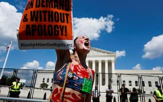 WASHINGTON, DC - JUNE 25: Abortion-rights activist Caroline Rhodes protests in front of the Supreme Court building following the announcement to the Dobbs v Jackson Women's Health Organization ruling on June 25, 2022 in Washington, DC. The Court's decision in the Dobbs v Jackson Women's Health case overturns the landmark 50-year-old Roe v Wade case, removing a federal right to an abortion. (Photo by Anna Moneymaker/Getty Images)