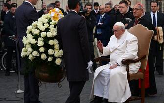 Pope Francis (R), escorted by Vicar General of Rome, Cardinal Angelo De Donatis (Rear R) pays a traditional visit on December 8, 2022 to the statue dedicated  to the Immaculate Conception near Piazza di Spagna in central Rome, celebrating the Solemnity of the Immaculate Conception. (Photo by Vincenzo PINTO / AFP) (Photo by VINCENZO PINTO/AFP via Getty Images)