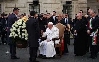 Pope Francis (C), escorted by Vicar General of Rome, Cardinal Angelo De Donatis (Rear C-R) and Rome mayor Roberto Gualtieri (R) pays a traditional visit on December 8, 2022 to the statue dedicated  to the Immaculate Conception near Piazza di Spagna in central Rome, celebrating the Solemnity of the Immaculate Conception. (Photo by Vincenzo PINTO / AFP) (Photo by VINCENZO PINTO/AFP via Getty Images)
