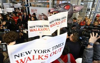 NEW YORK, UNITED STATES - DECEMBER 08: Employees of the New York Times (NYT) gather as they hold banners to protest the newspaper management in front of the New York Times building after the negotiations between the union and the management failed in New York, United States on December 08, 2022. New York Times employees went on a 24-hour walkout.  (Photo by Fatih Aktas/Anadolu Agency via Getty Images)