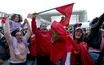 epa10359750 Fans celebrate after Morocco won the FIFA World Cup 2022 quarter final match between Morocco and Portugal, Rabat, Morocco, 10 December 2022.  EPA/JALAL MORCHIDI