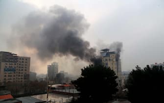 epa10361754 Smoke billows from a guest house after an attack in Kabul, Afghanistan, 12 December 2022. The Afghan capital was rocked by a loud blast and gunfire on 12 December, near one of the guest houses popular with Chinese business visitors.  EPA/STR
