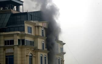 epa10361752 Smoke billows from a guest house after an attack in Kabul, Afghanistan, 12 December 2022. The Afghan capital was rocked by a loud blast and gunfire on 12 December, near one of the guest houses popular with Chinese business visitors.  EPA/STR