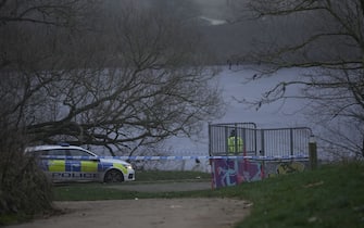 SOLIHULL, ENGLAND - DECEMBER 12: Emergency workers resume searches to determine if there was anyone else in the water on December 12, 2022 at Babbs Mill Park in Solihull, England. Four children were taken to hospital in critical condition after falling through an icy lake here last night. The search continued for more potential victims, following reports more children were present on the ice at the time of the incident. (Photo by Christopher Furlong/Getty Images)