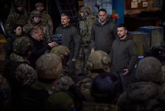 epa10374710 A handout photo made available by the Ukrainian Presidential Press Service shows Ukraine's President Volodymyr Zelensky (R) meeting with Ukrainian servicemen during his visit to Bakhmut, Donetsk region, eastern Ukraine, 20 December 2022, amid Russia's invasion. Zelensky visited the frontline city of Bakhmut where he presented state awards to Ukrainian military personnel, the Ukraine's Presidential office said in a statement. Russian troops entered Ukraine on 24 February 2022 starting a conflict that has provoked destruction and a humanitarian crisis.  EPA/UKRAINIAN PRESIDENTIAL PRESS SERVICE HANDOUT -- MANDATORY CREDIT: UKRAINIAN PRESIDENTIAL PRESS SERVICE -- HANDOUT EDITORIAL USE ONLY/NO SALES