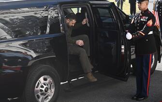 Ukraine's President Volodymyr Zelensky steps out of an SUV as he arrives to meet US President Joe Biden at the White House, in Washington, DC on December 21, 2022. - Zelensky is in Washington to meet with US President Joe Biden and address Congress -- his first trip abroad since Russia invaded in February. (Photo by Brendan SMIALOWSKI / AFP) (Photo by BRENDAN SMIALOWSKI/AFP via Getty Images)