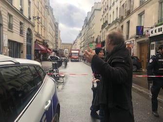 PARIS, FRANCE - DECEMBER 23: Police cordon-off an area after a gunfire left two people dead and four injured in Paris, while a suspect had been arrested, in France on December 23, 2022. According to a report a man in his seventies is suspected of having fired gunshots on the Enghien street in the center of Paris, killing at least two people and injuring four others. (Photo by Esra Taskin/Anadolu Agency via Getty Images)