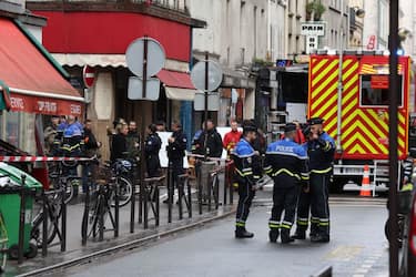 French security personnel secure the street after several shots were fired along rue d'Enghien in the 10th arrondissement, in Paris on December 23, 2022. - Two people were killed and four injured in a shooting in central Paris on December 23, 2022, police and prosecutors said, adding that the shooter, in his 60s, had been arrested. The motives of the gunman remain unclear, with two of the four injured left in a serious condition, the French officials said. (Photo by Thomas SAMSON / AFP) (Photo by THOMAS SAMSON/AFP via Getty Images)