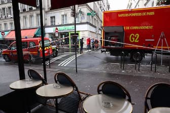 Police tape is used to cordoned off the area following a shooting along rue d'Enghien in the 10th arrondissement, in Paris on December 23, 2022. - Three people were killed and four injured in a shooting along rue d'Enghien in central Paris on December 23, 2022, police and prosecutors said, adding that the shooter, in his 60s, had been arrested. (Photo by Thomas SAMSON / AFP) (Photo by THOMAS SAMSON/AFP via Getty Images)