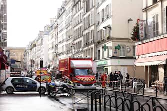 The road is cordoned off following a shooting along rue d'Enghien in the 10th arrondissement, in Paris on December 23, 2022. - Three people were killed and four injured in a shooting along rue d'Enghien in central Paris on December 23, 2022, police and prosecutors said, adding that the shooter, in his 60s, had been arrested. (Photo by Thomas SAMSON / AFP) (Photo by THOMAS SAMSON/AFP via Getty Images)